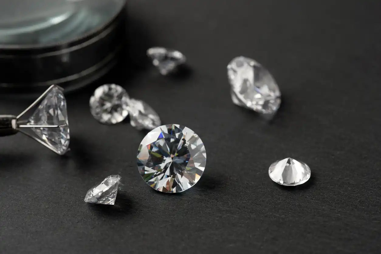 Loose lab-grown diamonds displayed on jeweller’s desk