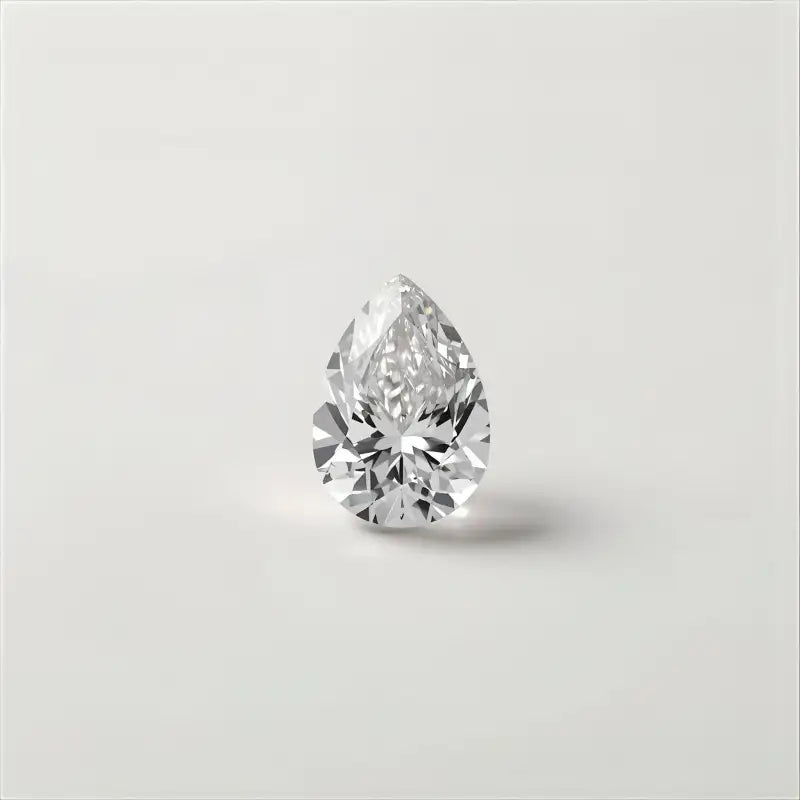 Pear Cut-shaped diamond on a light grey background